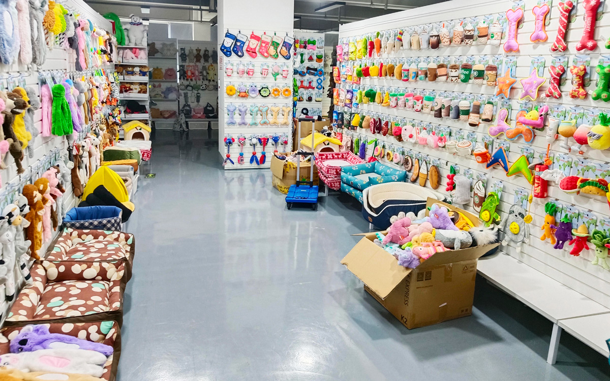 Plush pet bed and toy wholesale showroom with diverse products
