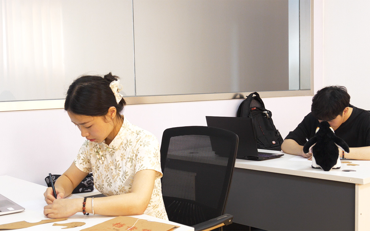 Pet plush toy designer working on product structure evaluation
